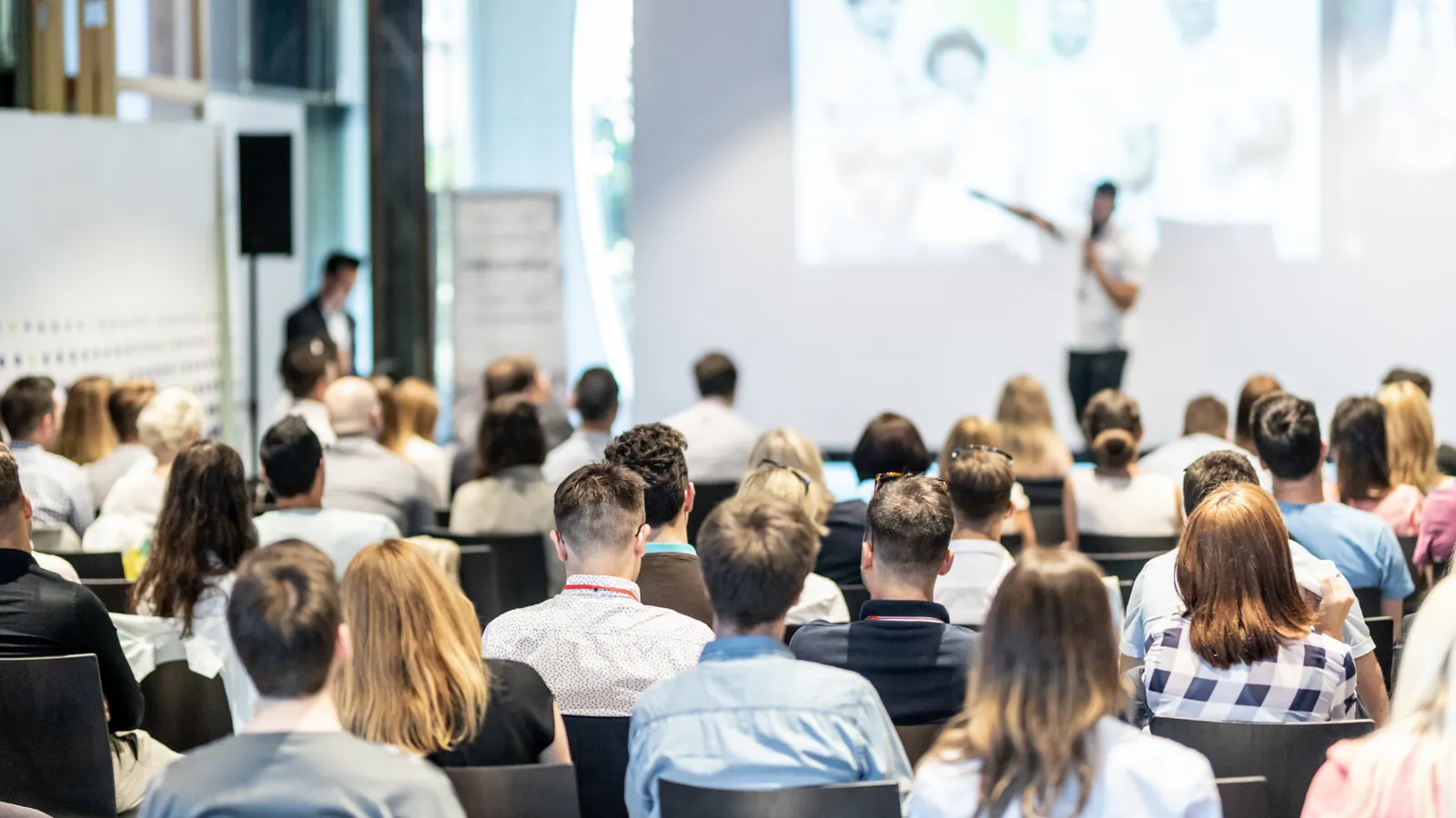 An audience seated at a business presentation.